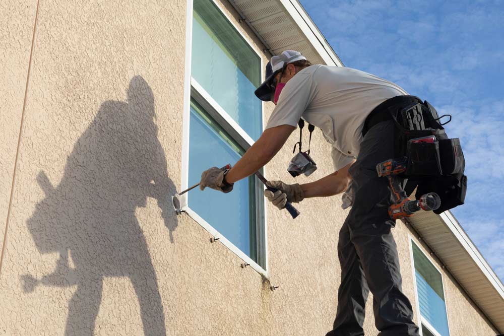 BC Testing inspector gathering stucco core samples